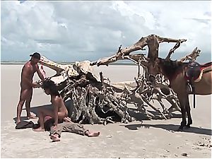 horny mexican woman gets two stiffys on the beach